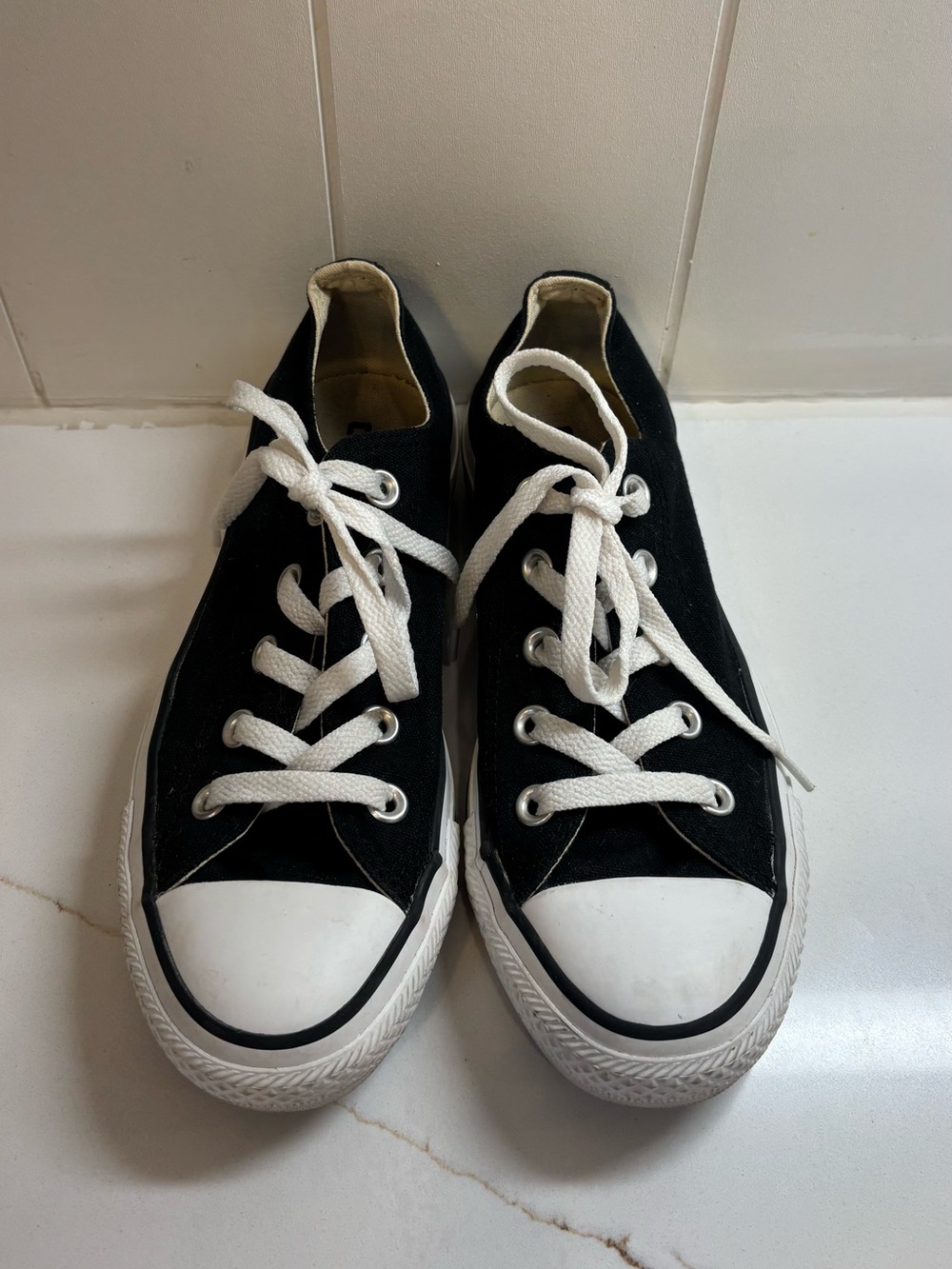Black Low-Top Converse Sneakers with White Laces